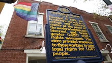 The entrance to "Giovanni's Room" - an LGBT bookstore with the American flag in pride colors 