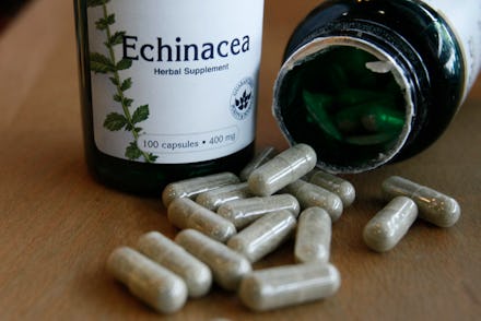 Two bottles and spilled Echinacea pills as Herbal Supplements 