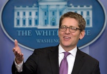 Jay Carney speaking in the white house press room to journalists