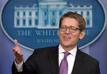 Jay Carney speaking in the white house press room to journalists