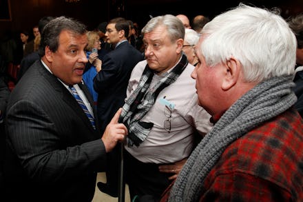Chris Christie talking with two men