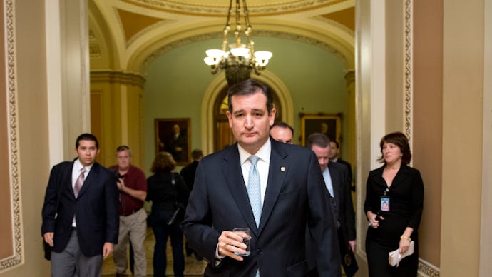Ted Cruz walking with his staff following him