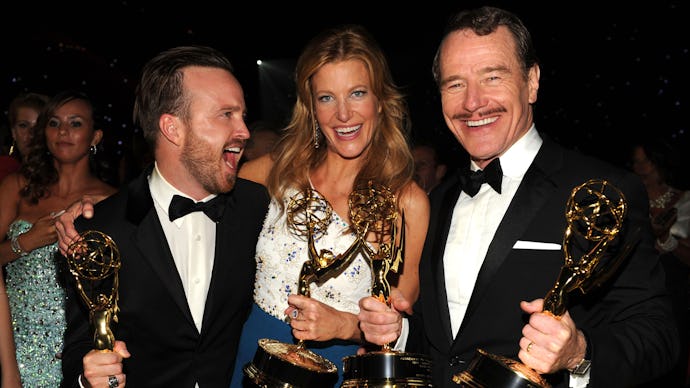 Aaron Paul, Anna Gunn, and Bryan Cranston posing for a photo