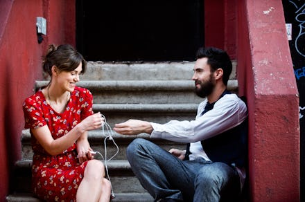 A couple sitting on stairs in Begin Again film