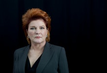 A portrait of Kate Mulgrew in in a black suit from 'Orange is the New Black'