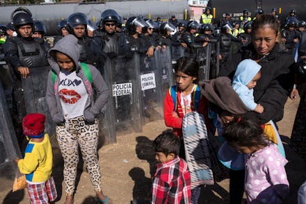 Immigrants surrounded by police