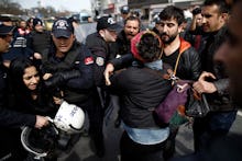 Women celebrating international women's day in turkey after the police fire rubber bullets at them