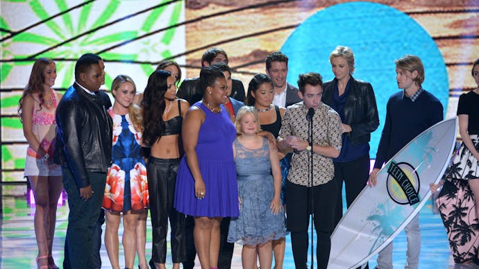 The cast of glee accepting an award at a kids tv awards show