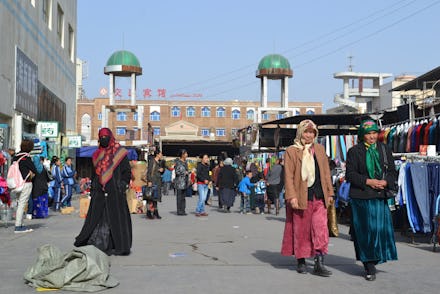 Xinjiang Uighurs walking on a street