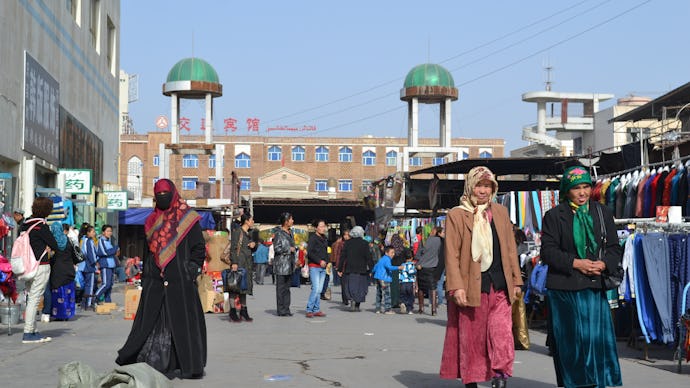  Xinjiang Uighurs walking on a street