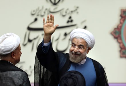Hassan Rouhani, president of Iran, smiling and waving