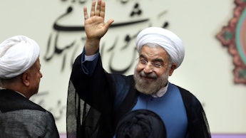 Hassan Rouhani, president of Iran, smiling and waving