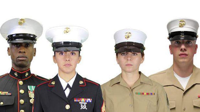 A group of marines wearing their uniforms, one set is black the other is beige