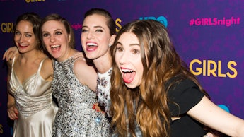 Four girls from HBO series Girls hugging each other at a series screening, with wide smiles on their...
