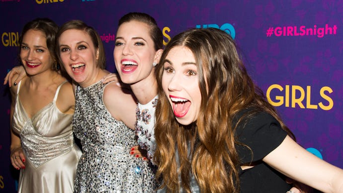 Four girls from HBO series Girls hugging each other at a series screening, with wide smiles on their...