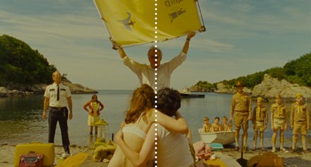 A scene from a Wes Anderson movie, with a happy couple hugging, an older man holding yellow banner, ...