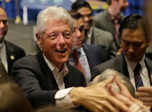 Bill Clinton shaking hands with the public