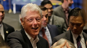 Bill Clinton shaking hands with the public
