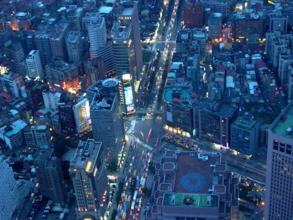 An aerial view of a busy city in Taiwan at night, with faster internet than the U.S.