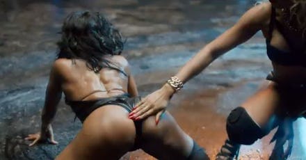 A woman smacking another woman on the bottom in Lily Allen's new music video which is supposed to em...