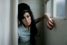 Amy Winehouse standing in the doorway.