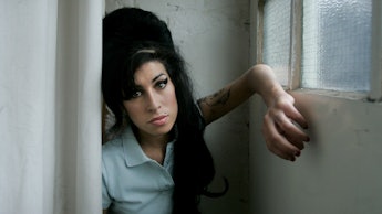 Amy Winehouse standing in the doorway.