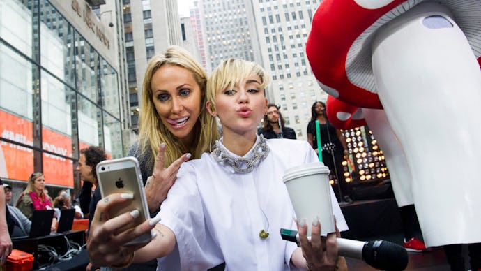 Miley Cyrus and her mom taking a selfie, exposing themselves to the government to collect data, as m...