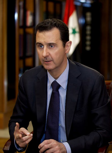 Bashar al-Assad talking during a meeting