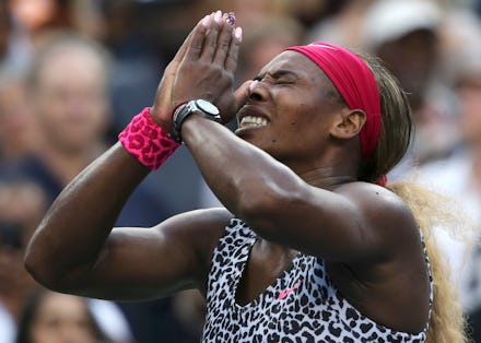Serena Williams pressing her hands together in gratitude with her eyes closed, in a leopard top and ...