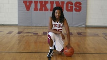 Kendrick Johnson posing for a photo with a basketball