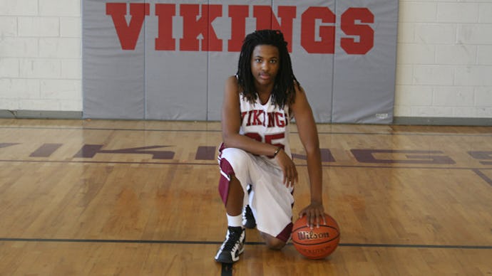 Kendrick Johnson posing for a photo with a basketball
