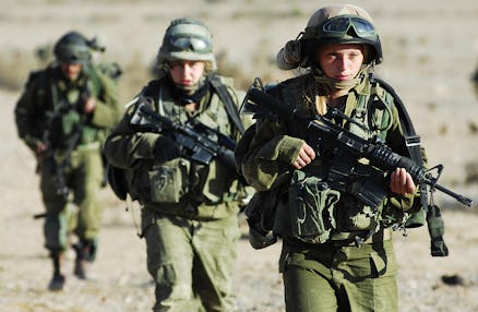 Orthodox women in the israel army marching in combat gear