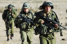Orthodox women in the israel army marching in combat gear