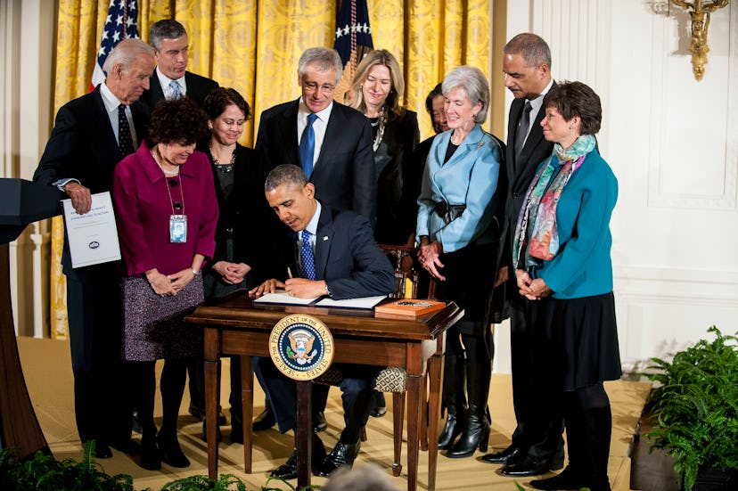 Barrack Obama signing the executive order 