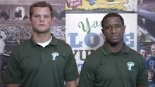 A screenshot from the moving video against domestic violence with two member from the Tulane Footbal...