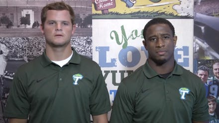 A screenshot from the moving video against domestic violence with two member from the Tulane Footbal...