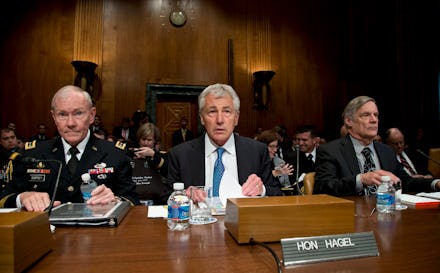 Martin Dempsey, Robert F. Hale and Chuck Hagel at a table with name cards in front of them