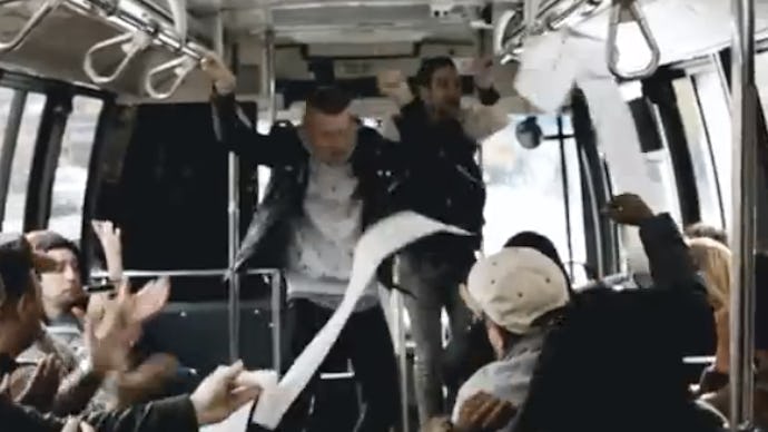 Mackelmore and Ryan Lewis getting on to a bus with people applauding them