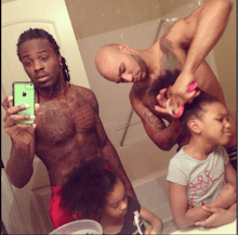 Two black, gay fathers Kordale and Kaleb preparing their daughters for school