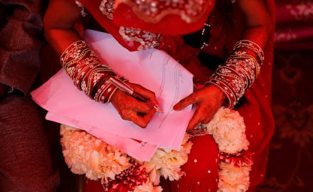 A woman in India in a Sari filing a lawsuit against marital rape