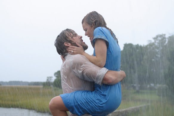 Ryan Gosling and Rachel McAdams passionately dancing and kissing in the rain in The Notebook