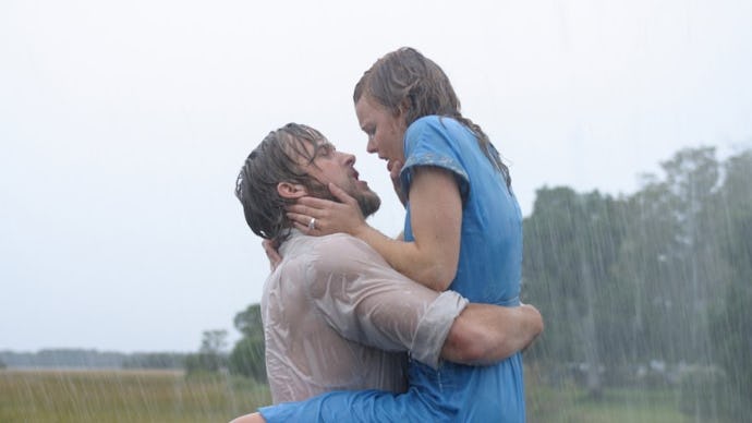Ryan Gosling and Rachel McAdams passionately dancing and kissing in the rain in The Notebook