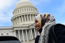 Ilhan Omar standing next to the United States Capitol