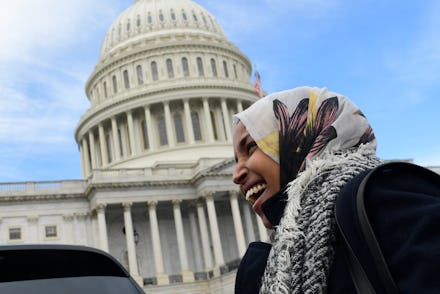 Ilhan Omar standing next to the United States Capitol