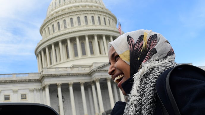 Ilhan Omar standing next to the United States Capitol
