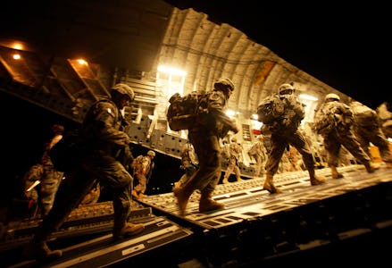 US Army soldiers entering a C-17 aircraft