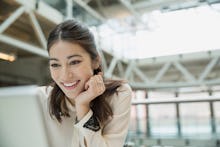 A woman at her job smiling 