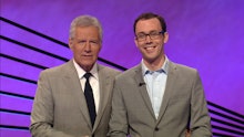 A 24-year-old Six-Time Jeopardy Champion, Jared Hall, posing with the host