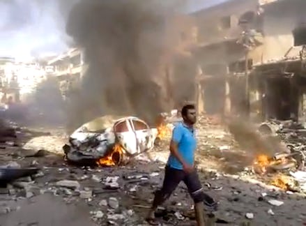 A street in ruins and fire in Syria