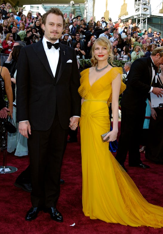 Heath Ledger and Michelle Williams holding hands at the red carpet